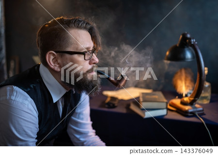 Closeup of a man smoking a traditional pipe Closeup of a man smoking a traditional pipe 143376049