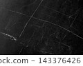 Textured background with a pattern made of black marble. 143376426