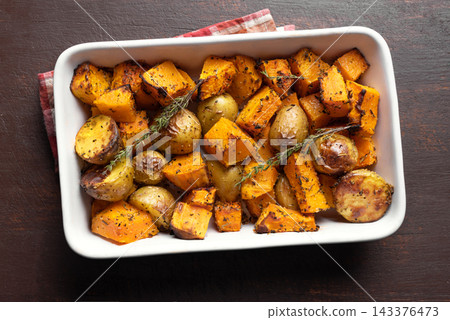 Autumn meal: oven roasted seasonal vegetables with garlic and herbs Autumn meal: oven roasted seasonal vegetables with garlic and herbs 143376473