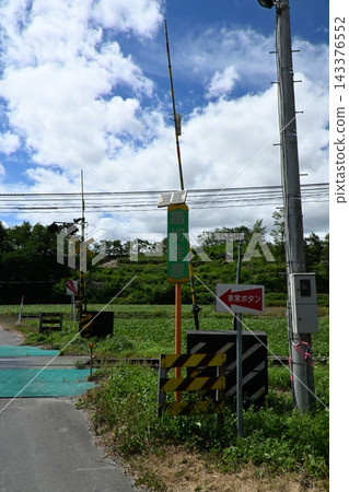 A railway crossing in Hokkaido and the summer sky A railway crossing in Hokkaido and the summer sky 143376552