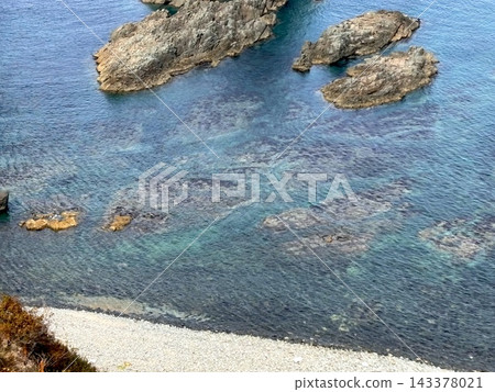 In September, October, early autumn, and autumn, at Shimamui Coast on the Shakotan Peninsula in Hokkaido, I see the Shakotan Blue sea. I emerge from a dark tunnel. In September, October, early autumn, and autumn, at Shimamui Coast on the Shakotan Peninsula in Hokkaido, I see the Shakotan Blue sea. I emerge from a dark tunnel. 143378021