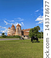 Horses graze on the lawn in front of Mir Castle. Republic of Belarus. 143378677