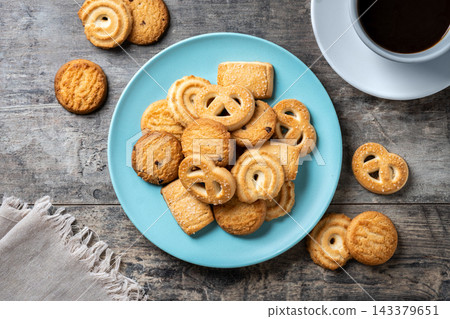 Assorted butter cookies on plate with cup of coffee 143379651