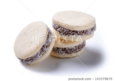 Traditional alfajores filled with dulce de leche and coconut Traditional alfajores filled with dulce de leche and coconut 143379679