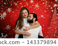 Romantic couple embracing on Christmas background 143379894