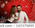 Romantic couple touching faces on Christmas background 143379895