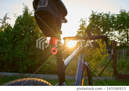 Rear view of gravel bike at sunset 143380915