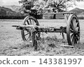 Black and white vintage wooden cart in a scenic mountain landscape 143381997