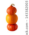 Three pumpkins stacked vertically, with orange pumpkin between two red kuri squash, isolated on white background. Autumn harvest arrangement for Halloween, Thanksgiving and seasonal design. 143382003