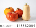 Variety of pumpkins top view on white background. Butternut, red kuri and orange squash for autumn harvest, Halloween and Thanksgiving designs. 143382004