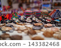 Row of inlaid abalone shell turtle figurines in selective focus 143382468