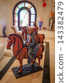 Bronze equestrian sculpture of figures on horseback in elegant interior 143382479