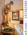 Gilded bronze statue of woman holding vase on shell fountain base 143382480