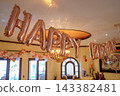 Rose gold happy birthday balloon banner in elegant room 143382481