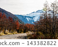 Autumn dirt road with Tronador mountain peak in Patagonia 143382822
