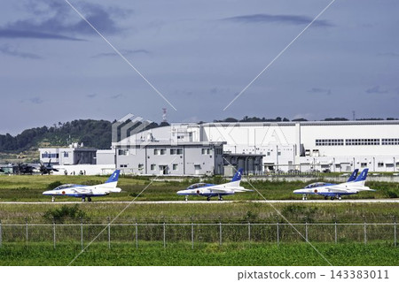Blue Impulse aerobatic team before takeoff against an autumn blue sky during flight training in Higashimatsushima City, Miyagi Prefecture. Blue Impulse aerobatic team before takeoff against an autumn blue sky during flight training in Higashimatsushima City, Miyagi Prefecture. 143383011