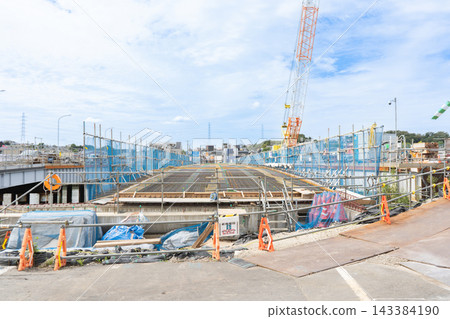 Reinforcement work 1: Arranging steel bars in a grid pattern on the deck of a bridge over a river. Reinforcement work 1: Arranging steel bars in a grid pattern on the deck of a bridge over a river. 143384190