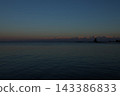 The Tateyama mountain range bathed in the soft glow of the setting sun. 143386833
