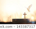 A background featuring the cross of Jesus Christ (symbolizing death and resurrection), a Bible, the dove of the Holy Spirit, prayer, and worship. 143387317