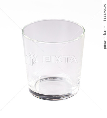 Empty clear drinking glass isolated on white background, transparent tumbler with thick base, studio product shot of simple glassware Empty clear drinking glass isolated on white background, transparent tumbler with thick base, studio product shot of simple glassware 143389089