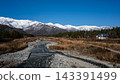 Snow-capped Northern Alps and trees with autumn foliage in Hakuba Village, Nagano Prefecture 143391499