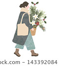 A woman walking with Christmas plants in her arms. 143392084