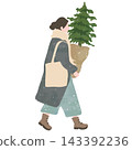 A woman walking while carrying a fir tree 143392236