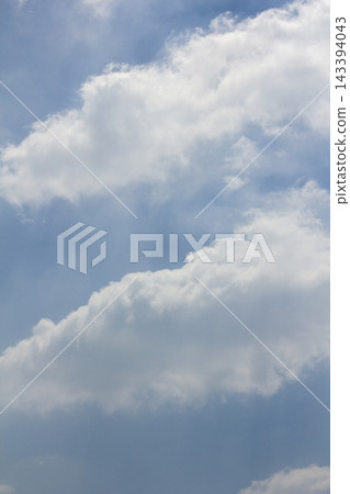 It is a blue sky with fluffy clouds. It is a blue sky with fluffy clouds. 143394043