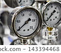 Pressure gauges displayed in a laboratory setting showing various measurements for scientific experiments 143394468