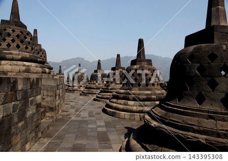 Borobudur Temple, Yogyakarta, Java, Indonesia - World Heritage Site - One of the world's three greatest Buddhist sites Borobudur Temple, Yogyakarta, Java, Indonesia - World Heritage Site - One of the world's three greatest Buddhist sites 143395308