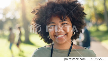 Black woman, portrait and happy in park for charity, volunteer and community service work with donation. African person, smile and green outdoor for project, change or sustainability with NGO support 143395539