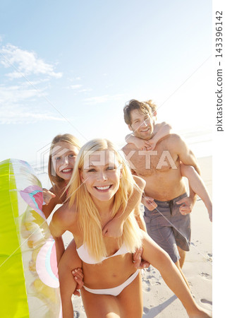 Portrait, beach and happy family piggyback kids on holiday together for summer vacation, travel or play with inflatable. Mother, father and carry children at sea for adventure, support or connection Portrait, beach and happy family piggyback kids on holiday together for summer vacation, travel or play with inflatable. Mother, father and carry children at sea for adventure, support or connection 143396142