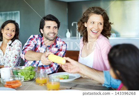 Happy, family and healthy brunch at table together for wellness, corn and juice for nutrition. Diversity, Man and woman with child in home or happy for diet with fresh salad, eating with smile Happy, family and healthy brunch at table together for wellness, corn and juice for nutrition. Diversity, Man and woman with child in home or happy for diet with fresh salad, eating with smile 143396268