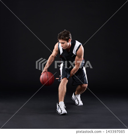 Basketball, dribbling and man in dark studio for sports, fitness exercise or training for strong body. Male athlete, black background and workout for game in gym, night with health and wellness Basketball, dribbling and man in dark studio for sports, fitness exercise or training for strong body. Male athlete, black background and workout for game in gym, night with health and wellness 143397085