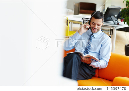 Businessman, reading and magazine with phone call on sofa for discussion, proposal or article at office. Happy man or employee talking on mobile smartphone with book for story, news or business cover Businessman, reading and magazine with phone call on sofa for discussion, proposal or article at office. Happy man or employee talking on mobile smartphone with book for story, news or business cover 143397478