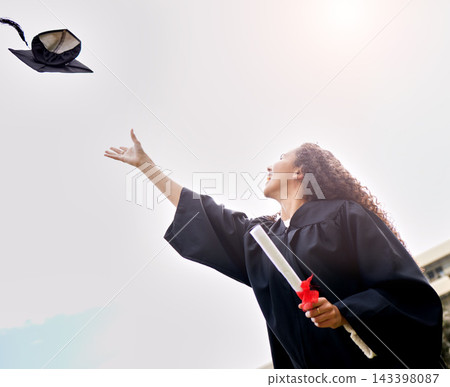 Woman, sky and graduation with hat for celebration, success and diploma for university student. Education, degree and female person for achievement in robe, ceremony and happiness with mortar in air Woman, sky and graduation with hat for celebration, success and diploma for university student. Education, degree and female person for achievement in robe, ceremony and happiness with mortar in air 143398087