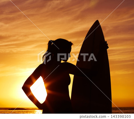 Sunset, ocean and woman surfer with silhouette for fitness or outdoor training with professional. Tranquil, health and beautiful beach coast for cardio with happiness, lens flare and surfboard. Sunset, ocean and woman surfer with silhouette for fitness or outdoor training with professional. Tranquil, health and beautiful beach coast for cardio with happiness, lens flare and surfboard. 143398103