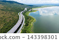 Drone shot The M6 motorway Nakhon Ratchasima Province - Bang Pa-in Lam Ta Khong River and Mountain. Motorway Korat Thailand 143398301