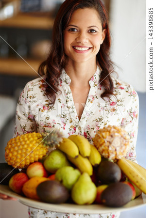 Woman, portrait and smile with fruit in bowl for guests in house with nutrition for health or natural diet. Nutritionist, organic and food with vitamins for variety with fiber, wellness and freshness Woman, portrait and smile with fruit in bowl for guests in house with nutrition for health or natural diet. Nutritionist, organic and food with vitamins for variety with fiber, wellness and freshness 143398685