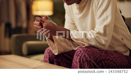 Black girl, hands and worry with stress on sofa for student loans or academic pressure, anxiety and depression. Woman, home and burnout on couch for fear of bad news or mistake, nervous and scared. Black girl, hands and worry with stress on sofa for student loans or academic pressure, anxiety and depression. Woman, home and burnout on couch for fear of bad news or mistake, nervous and scared. 143398752