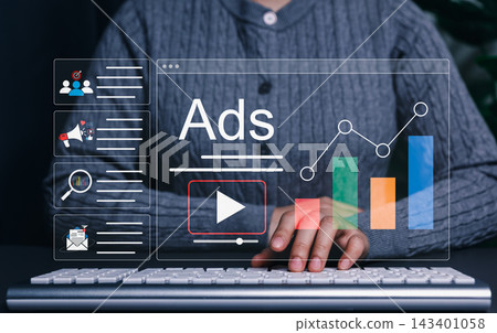 Digital Marketing and Online Advertising Strategy Concept. Marketer using computer with advertising icons, performance metrics, audience targeting, and campaign strategy analytics for online Digital Marketing and Online Advertising Strategy Concept. Marketer using computer with advertising icons, performance metrics, audience targeting, and campaign strategy analytics for online 143401058