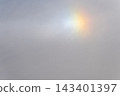 Rainbow flare light phenomenon in the daytime sky 143401397
