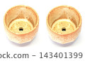 The ceramic cup has been adapted for planting small pot plants 143401399