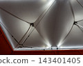 It was located in a large hall, under a clean white canvas roof, with beautiful lighting 143401405