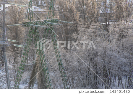 High Voltage Power Line Transmission Tower in Winter High Voltage Power Line Transmission Tower in Winter 143401480