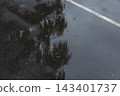 A park basketball court wet from the rain 143401737