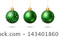 Three green Christmas ornaments with star, plain, and wave patterns hanging on strings on a white background. 143401860