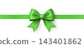 Large bright green satin bow attached to a horizontal green ribbon on a white background 143401862