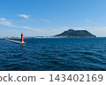 The red lighthouse at the entrance to Hakodate Port and Mount Hakodate. 143402169