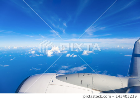 Blue sky seen from inside an airplane Blue sky seen from inside an airplane 143403239